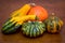 Autumn harvest. Composition of decorative pumpkins on a wooden table