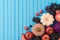 Autumn harvest concept. Pumpkin, apple and grapes on blue wooden background. Top view, flat lay