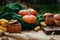 Autumn harvest, corn, apples, lavender, large orange pumpkin on a green knitted scarf 3