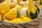 Autumn harvest in a farm market. Decorative pumpkins in a basket