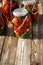 Autumn harvest of red tomatoes, horseradish and garlic in jars for preservation