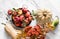 Autumn harvest - ripe red apples, pumpkins, zucchini on a light marble background, top view