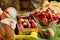 Autumn harvest in a wooden box and basket. Corn on the background of hay