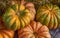 Autumn harvest yellow and orange ribbed pumpkin closeup background vegetable design