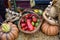 Autumn harvesting agriculture scenery with pumpkins, red peppers, autumn vegetables, bale of hay