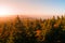 Autumn haze illuminated by sun above mountain peaks, Eagle Mountains, Orlicke hory, Czech Republic