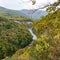 autumn in the highlands, panorama, dried vegetation of alpine meadows, forest and rest in the mountains.