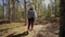 Autumn hike backpacker lifestyle woman walking on trek trail in forest outdoors