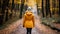 Autumn hiking adventure active woman hiker exploring scenic forest trail in vibrant fall season
