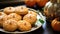 Autumn holiday glazed gingerbread homemade cookies on blurred background with fall leaves and pumpkins. Cozy home atmosphere