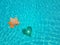 Autumn holidays love heart swimming pool water light  blue and a dry leaf