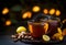 Autumn hot tea with ginger, lemon, honey and spices at dark rusty table