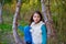 Autumn kid girl relaxed in forest with green canes