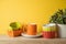 Autumn kitchen interior background with plant, colorful bowls and coffee cup on wooden shelf