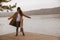 autumn lake season woman in coat at wooden pier