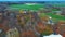 Autumn Landscape Aerial Shot Vilce Manor in Latvia. Colorful Trees, and Pine Woods in the Manor Park.