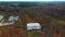 Autumn Landscape Aerial Shot Vilce Manor in Latvia. Colorful Trees, and Pine Woods in the Manor Park.