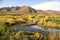 Autumn landscape of beaver dam and colorful mountains