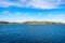 Autumn landscape of the coast of Sweden. Forest islands with colorful trees in the gulf of the Baltic Sea. Panoramic view of