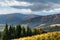 Autumn landscape. Coniferous forest on the hills.