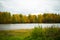Autumn landscape of the countryside, Golden autumn, colorful foliage, green grass, lake, Russia