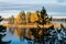 Autumn landscape of the island in the middle of the water and the forest