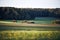 Autumn landscape with layers of agricultural fields in a moody fall scene