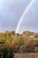 Autumn landscape with a rainbow