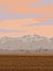 Autumn Landscape with  Red Sky, Mountains,  Grassland and Flying Birds