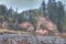 Autumn landscape and red stone cliff of Amata river, Latvia, Europe.