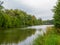 Autumn landscape of river and trees. Riverside landscape.