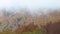 Autumn landscape from a Spanish mountain Montseny with clouds and colorful forest