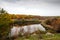 Autumn landscape. Steep rocky coast and stormy rapids.