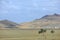 Autumn landscape, steppe with mountains. prairie, veld, veldt. a