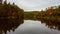 Autumn Landscape View of the Gauja River Surrounded by Forests Colorful Bright Yellow Orange and Green Trees, Sunny Day.