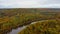 Autumn Landscape View of the Gauja River Surrounded by Forests Colorful Bright Yellow Orange and Green Trees, Sunny Day.