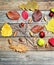 Autumn leaves with acorn, twig, chestnut over wooden background