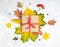 Autumn leaves background with a wrapped gift box