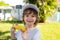 Autumn lifestyle. Homegrown organic food. Vegan children nutrition. Happy boy eating corn on the cob.