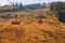 Autumn Majesty: Vintage Cable Car Embraced by Sunlit Mountain Splendor