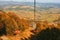 Autumn Majesty: Vintage Cable Car Embraced by Sunlit Mountain Splendor