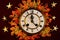 Autumn maple leaves, different colors of yellow, gold and red on the background of vintage watches,