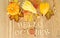 Autumn maple leaves and pumpkins on sunny day. Great season texture with fall mood. Nature october background with hand lettering