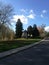 Autumn mood, steeple, calm road, fallen leaves of nostalgic trees