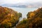 Autumn morning on the river surrounded by mountains