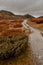 Autumn mountain landscape of Rondane National Park in Norway, trail from SmuksjÃ¸seter Fjellstue to Peer Gynt hytta