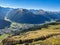 Autumn mountain panorama in the Parsenn Davos Klostes Mountains. Hiking and trail running. Snowy mountain peaks.