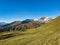 Autumn mountain panorama in the Parsenn Davos Klostes Mountains. Hiking and trail running. Snowy mountain peaks.