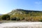 Autumn in the mountains limestone cliff surrounded by colorful forest