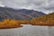 Autumn. A mouth of the stream running into lake of Jack London. Mountains in snow